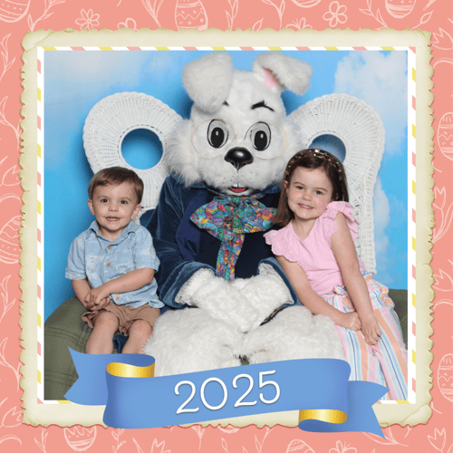 two young children sitting with the Bunny and posting for a photo