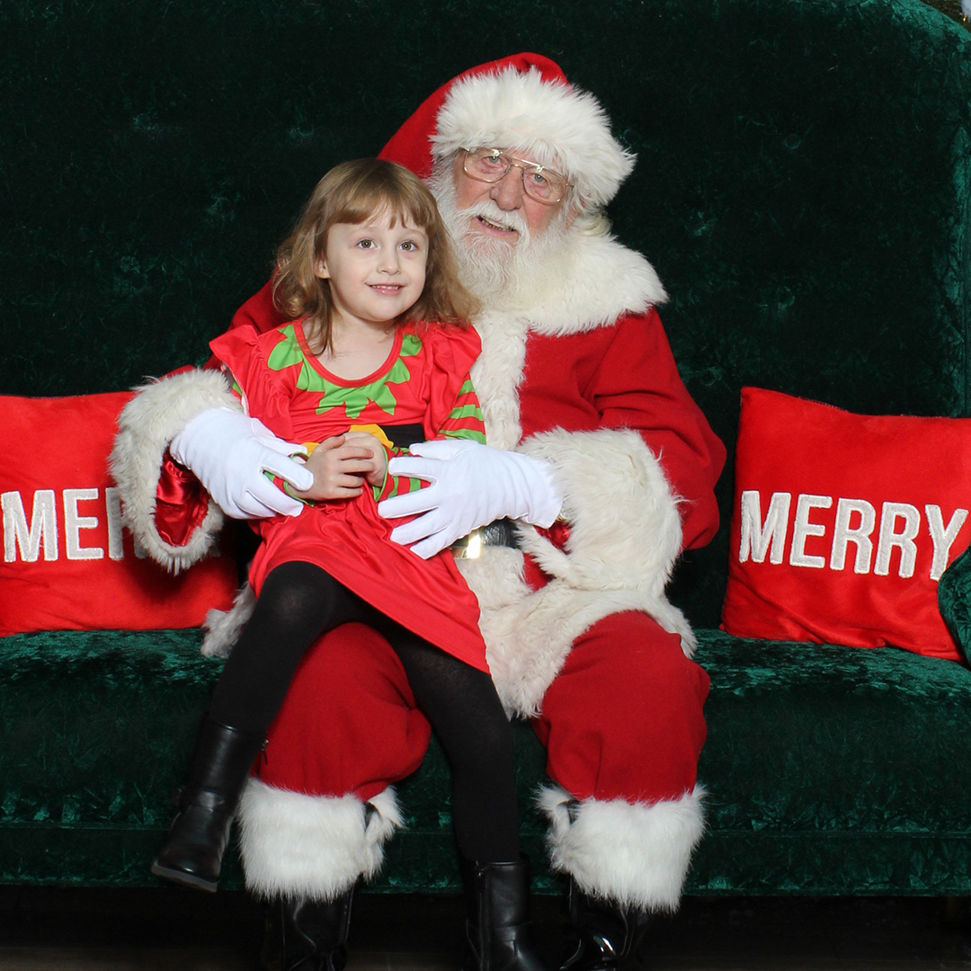 family visiting with santa