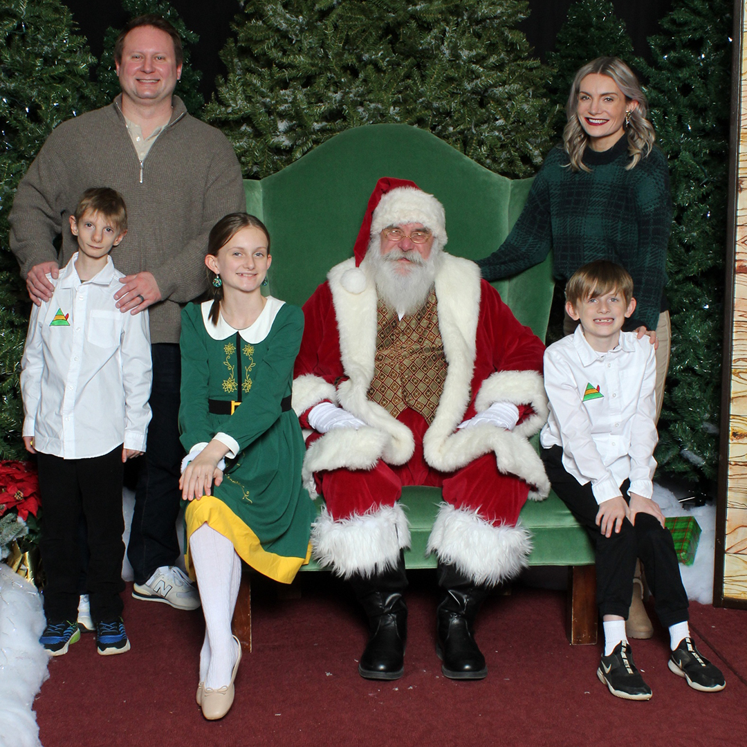 family visiting with santa