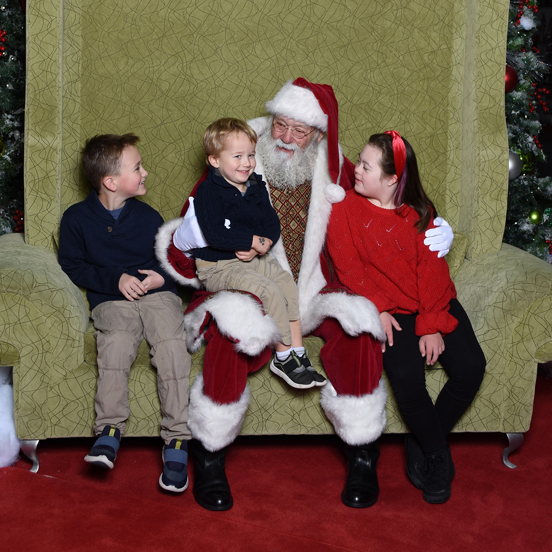 family visiting with santa