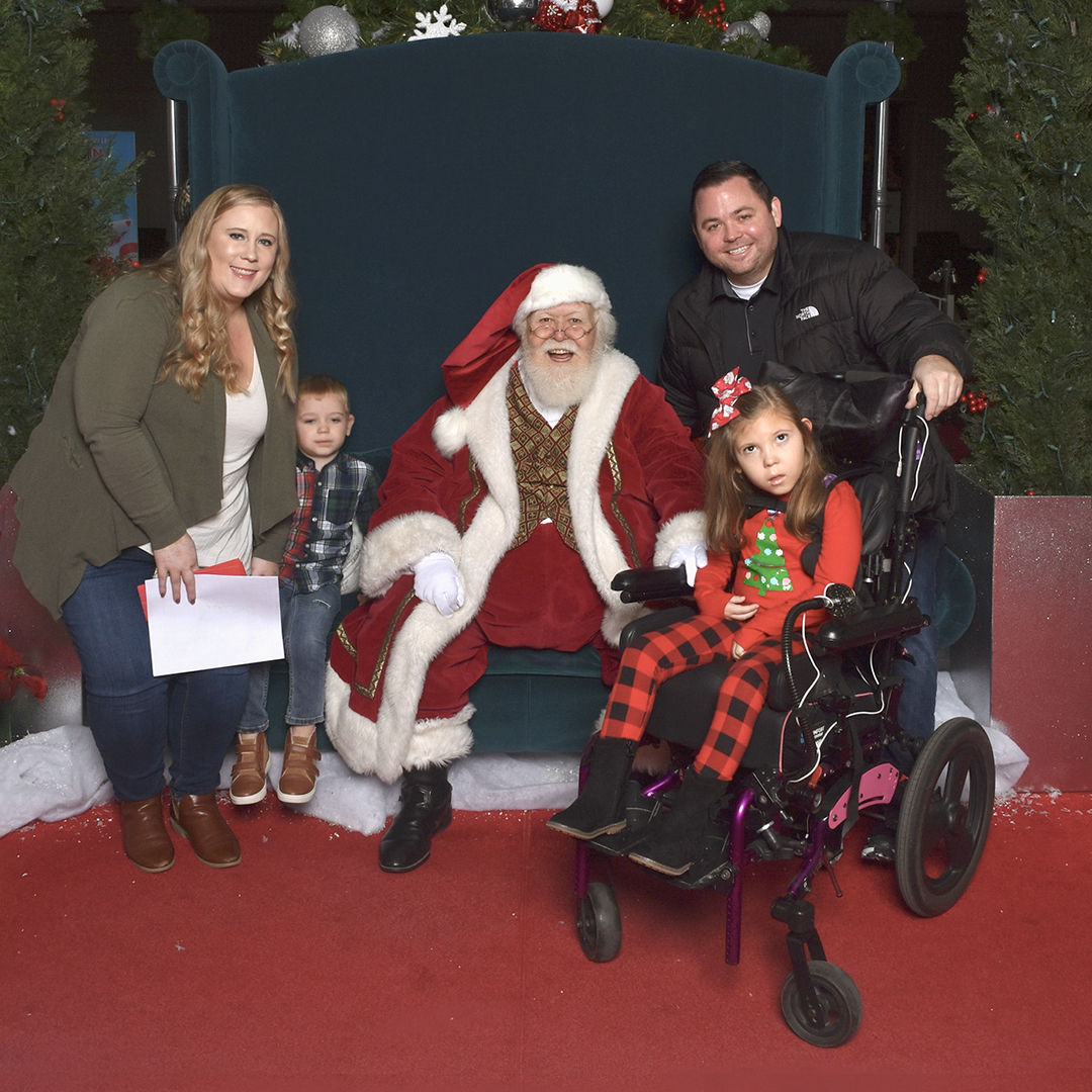 family visiting with santa