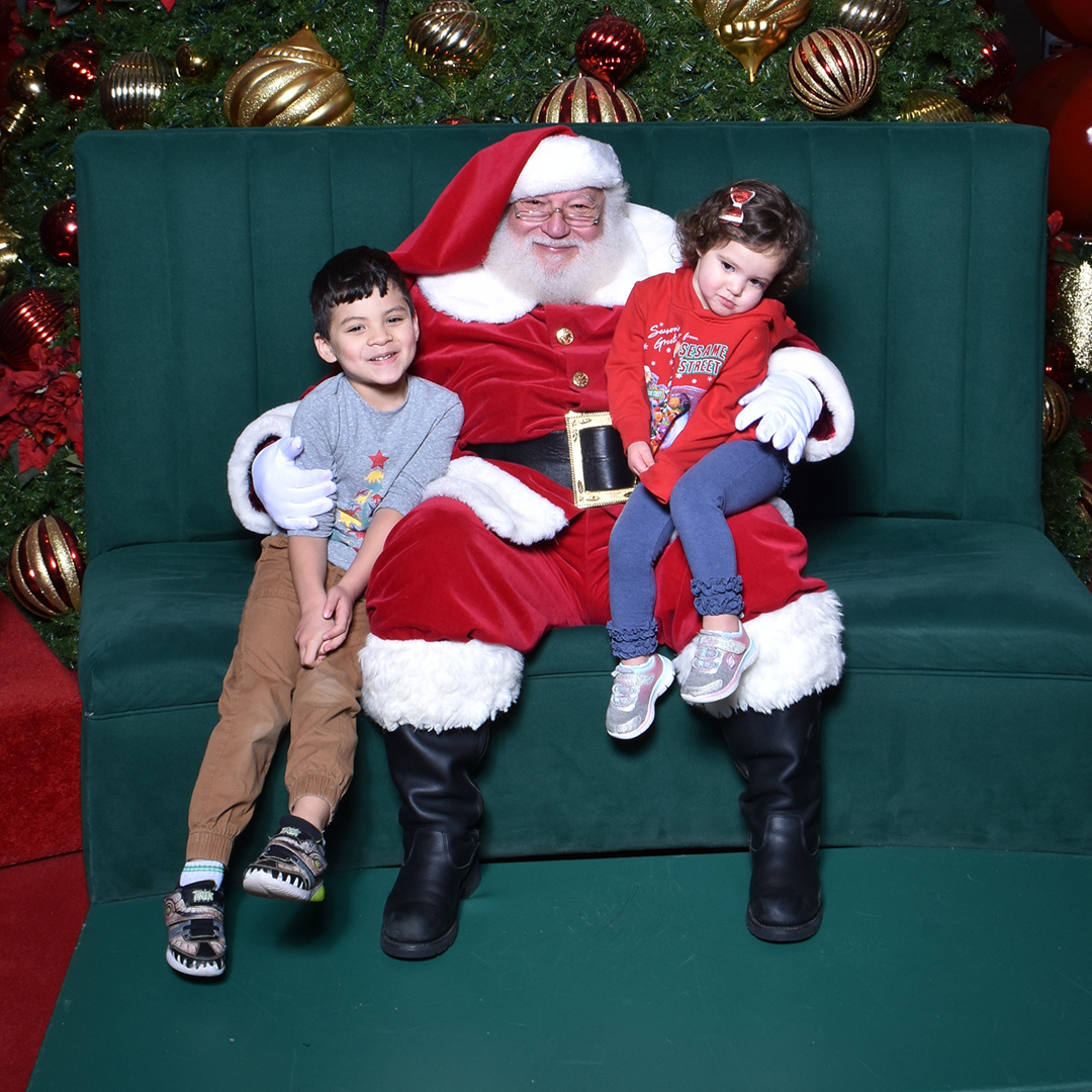 family visiting with santa