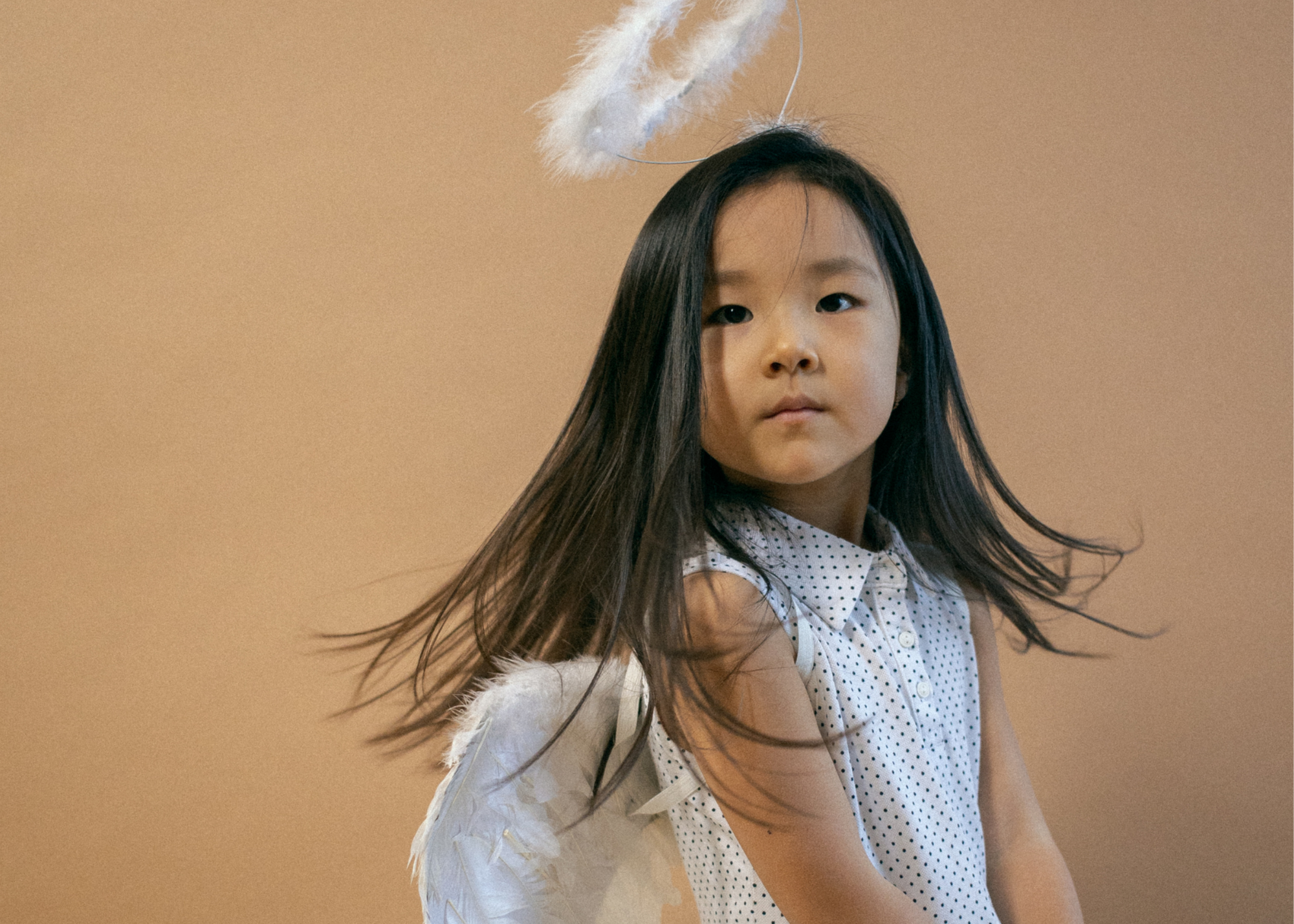 little girl in angel costume