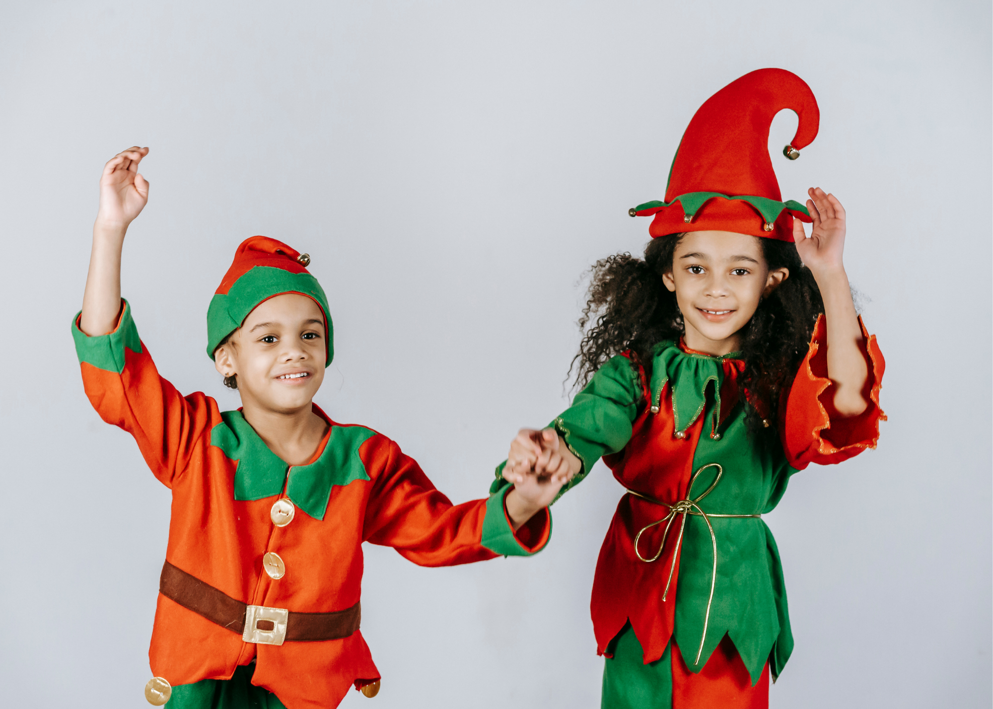 two children in elf costumes